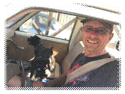 A person with two dogs in a car

Description automatically generated with medium confidence