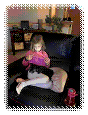 A child sitting on a couch with a dog

Description automatically generated with low confidence
